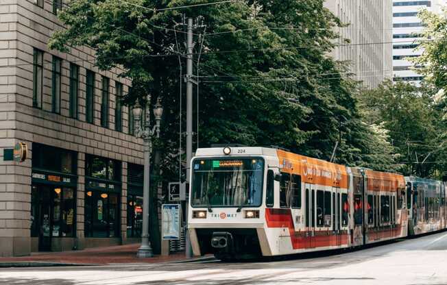 a train on the street in a city
