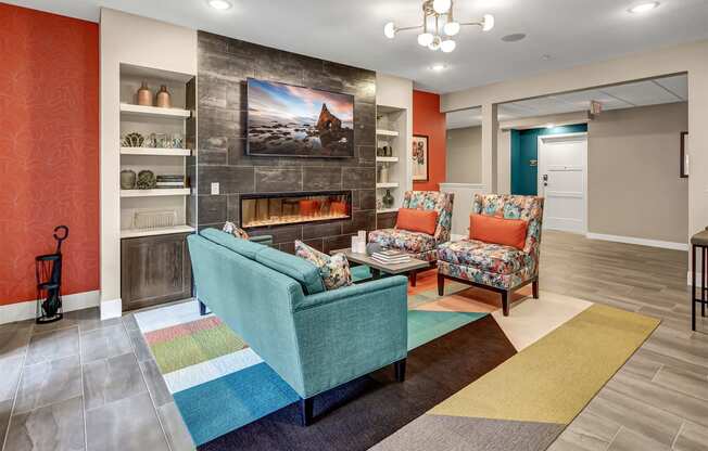 a living room with couches and chairs and a fireplace