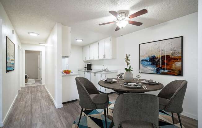 a dining area with a table and chairs and a kitchen in the background at Kirkwood Meadows, Idaho, 83201