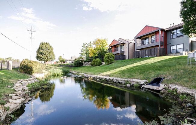 Pond behind apartments