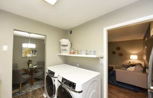 Two BR Apartments in Vestavia Hills, AL - MarQ Vestavia - Full-Size Front Load Washer and Dryer with Shelving and Hardwood-Style Flooring