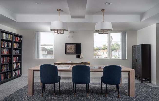 a living room filled with furniture and a book shelf