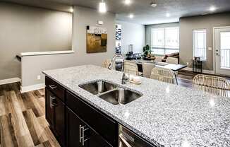 Kitchen with stainless steel appliances at Sterling Prairie Trail North in Ankeny, IA