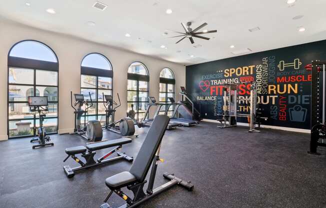 Gym with treadmills and weights at Arrive Temecula