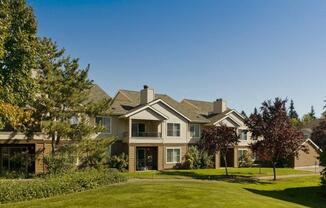 a large lawn in front of a large house