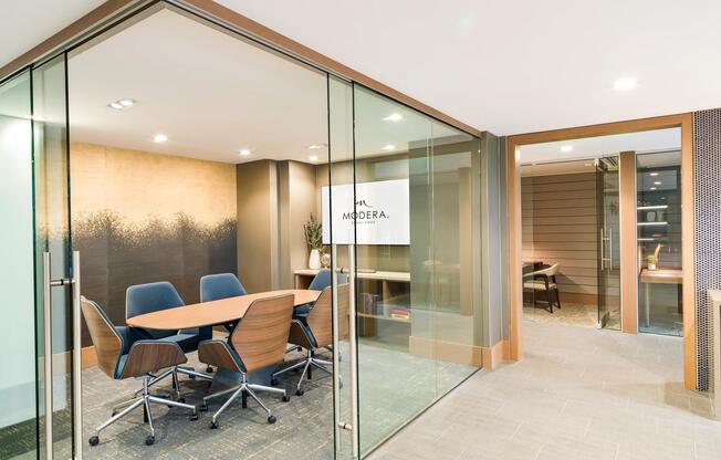 A polished conference room at Modera McGavock, offering a professional setting for meetings and focus, with downtown Nashville just minutes away.