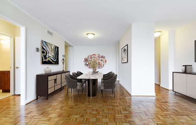 A dining room with a table set for four.