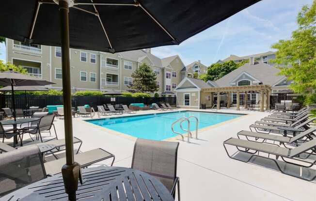 our apartments offer a swimming pool with chairs and umbrellas