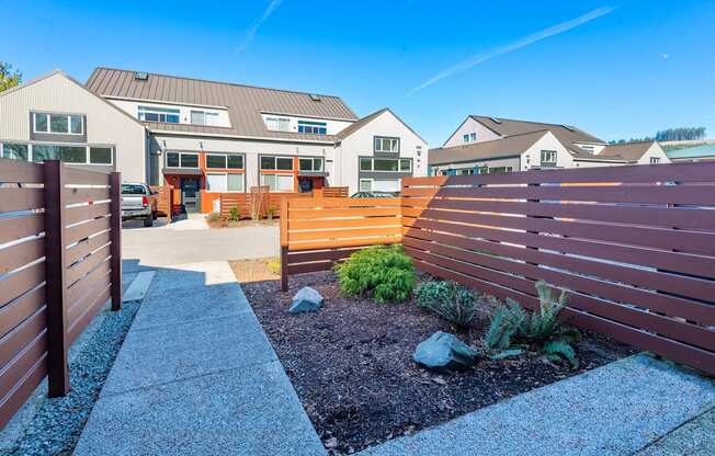 a wooden fence in front of a house