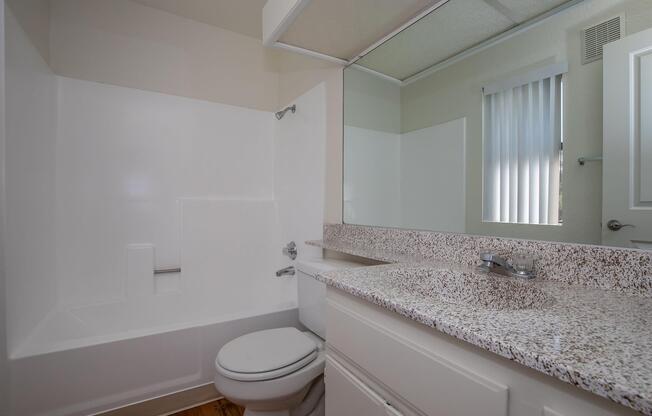 bathroom with granite countertops