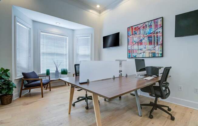 A room with a white table and chairs.