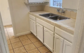 1421 E 108 ST
