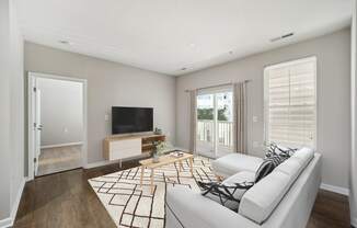 Living Room With TV at MetroPlace at Town Center, Camp Springs