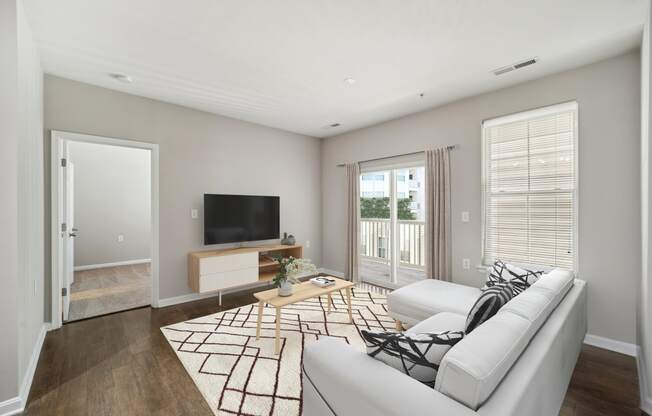 Living Room With TV at MetroPlace at Town Center, Camp Springs