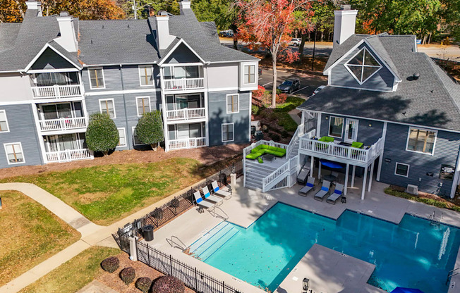 A large house with a pool in the backyard.