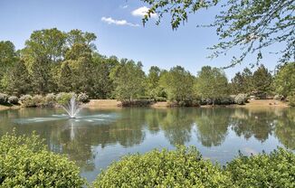 a fountain in the middle of a lake