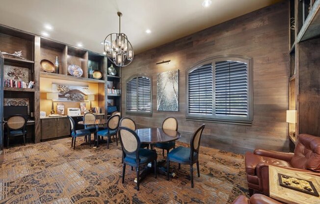 a dining room with a table and chairs