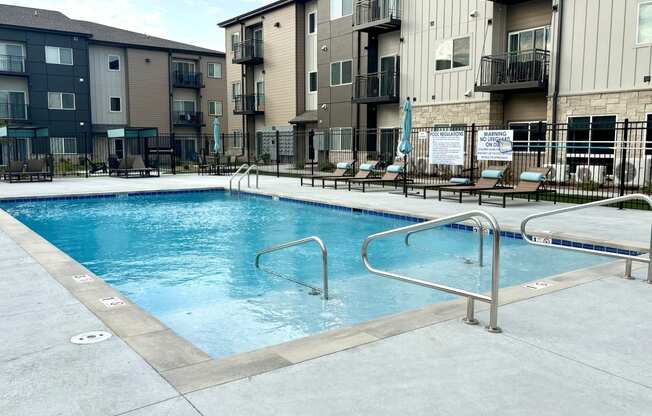 a swimming pool in the middle of an apartment building