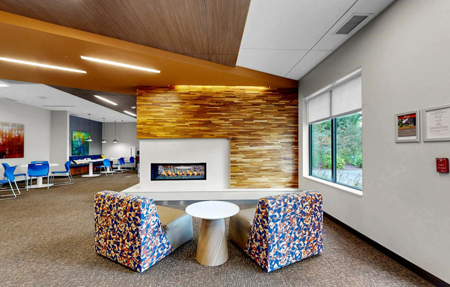 A room with a fireplace and a wooden wall.