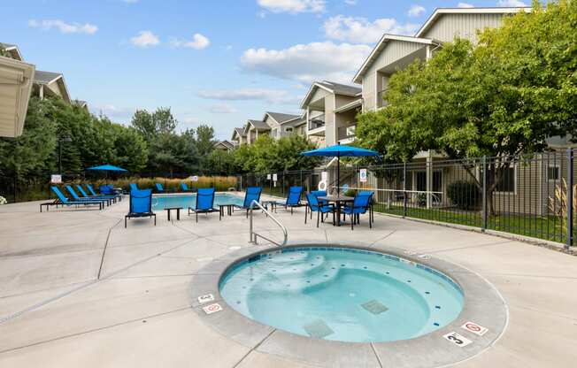 the preserve at ballantyne commons resort swimming pool with blue chairs and