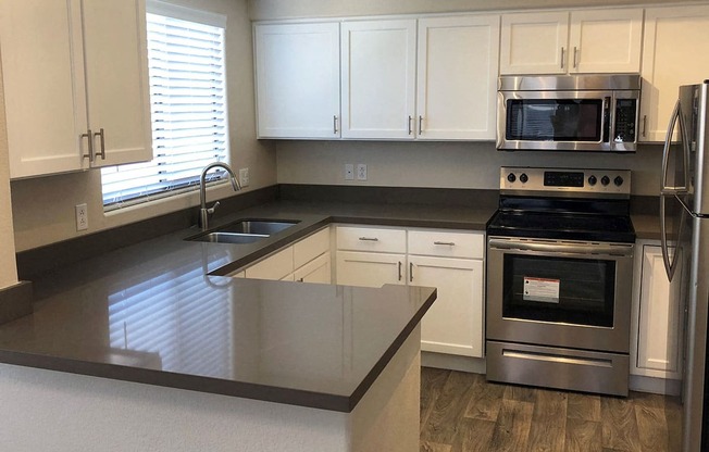 Kitchen with Stainless Steel Appliances at Apartments near University of Arizona