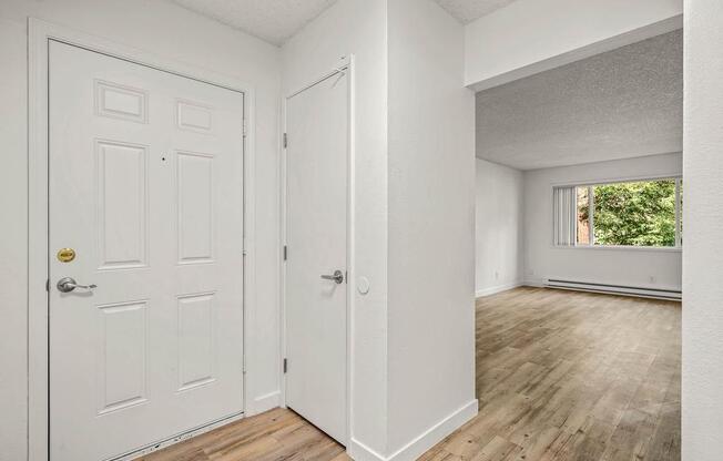 an empty room with a door open