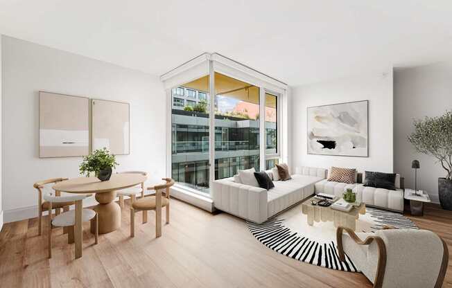 A living room with a white sofa, a wooden table and a zebra print rug.