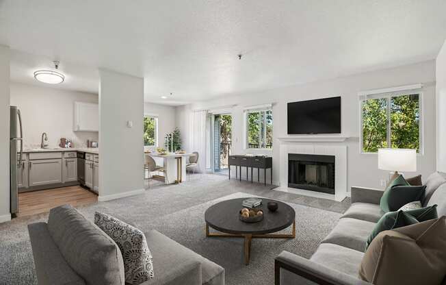 A modern living room with a grey couch and a coffee table.