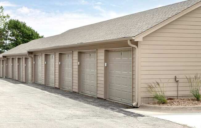 A long building with many garage doors.