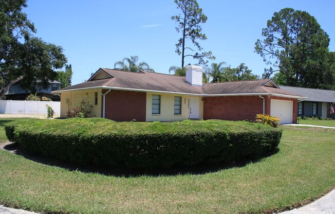 Enjoy Peaceful Living in this Northdale Corner Lot Single Family Home