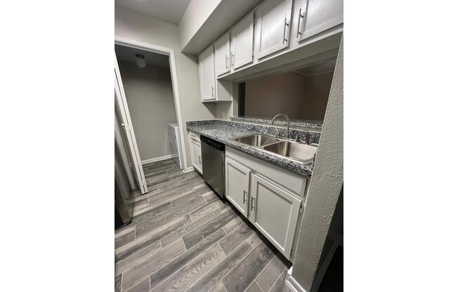 a kitchen with a building in the background