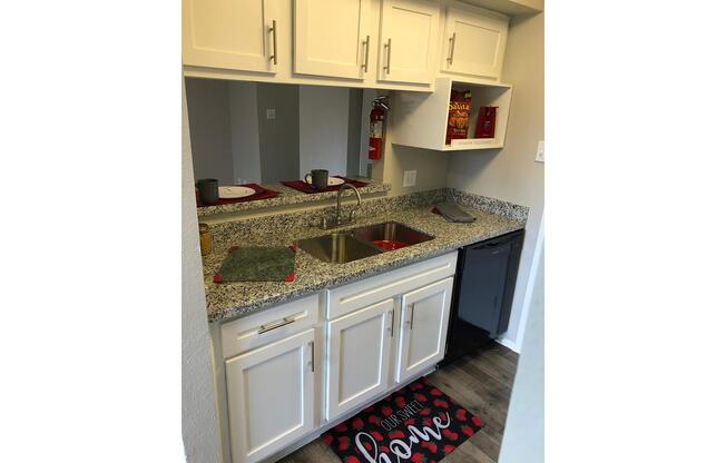 a kitchen with a stove and a refrigerator