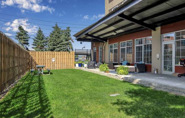 a backyard with a patio and a fence at The Lofts at Elk Terminal, Buffalo, NY, New York