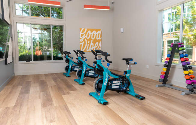 a group of exercise bikes in the fitness room