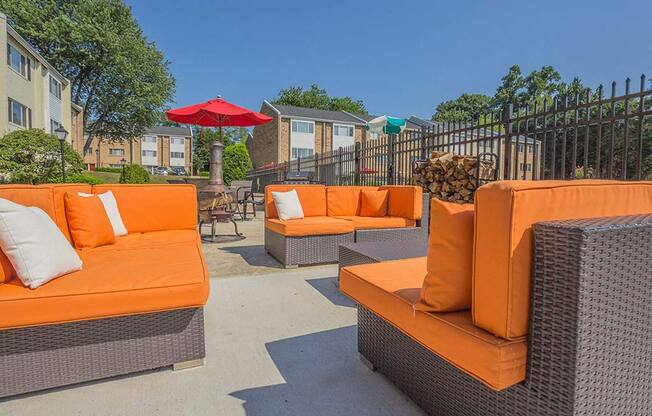 Orange outdoor couches in sunshine at Tysons Glen Apartments and Townhomes, Virginia
