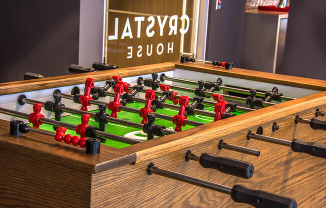 a game of foosball on a table in a room