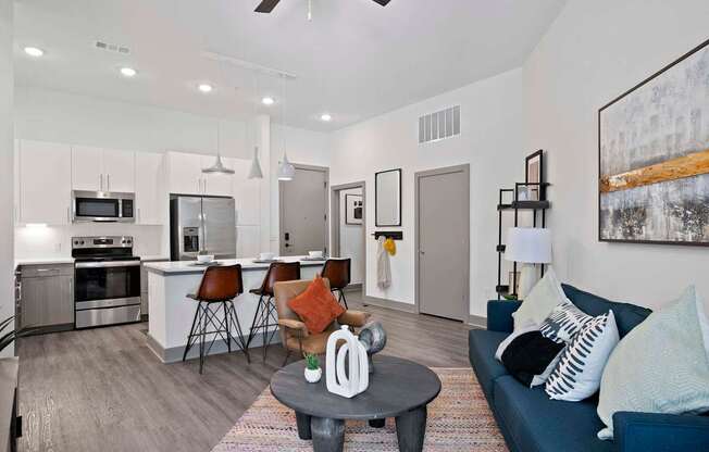 A modern kitchen with a dining table and chairs.