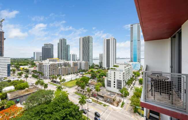 a view of the miami skyline from a balcony