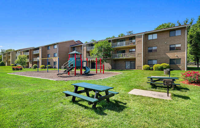 our apartments have a playground and picnic tables