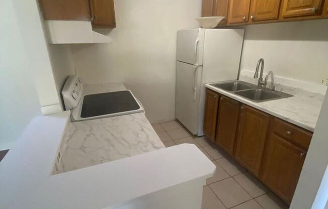 Great 2 bedroom 2 bath condo with screened balcony, private fenced courtyard and storage area