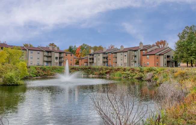 Lush grounds with pond at Hunt Club Apartments, Integrity Realty, 44321