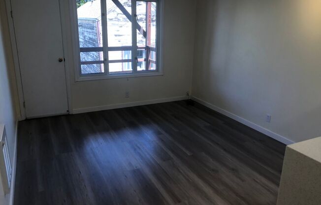 PRICE REDUCED - Remodeled top floor rent controlled apartment w/ parking, storage and water, garbage and laundry included