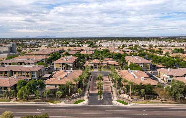A suburban neighborhood with houses and palm trees. at The Laurel Apartments, Chandler
