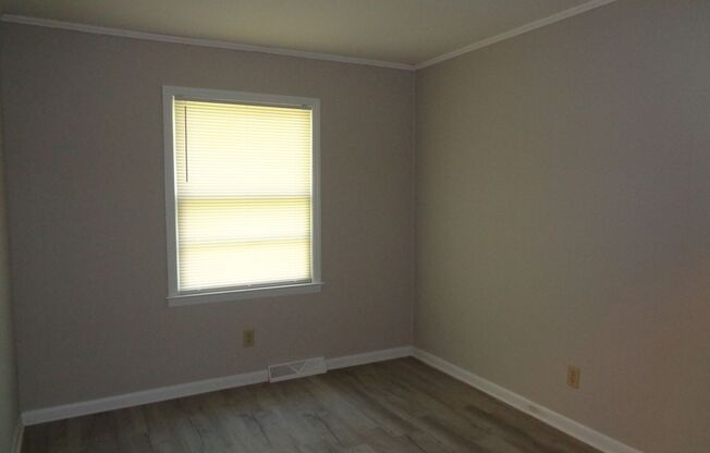 Lovely three bedroom, one bath home nestled in an attractive neighborhood setting.