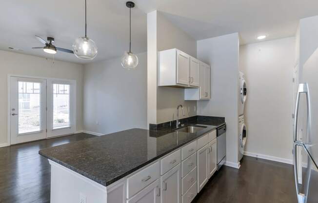 Ashland Farms Galley Style Kitchen with Ample Cabinet Storage and Separate Washer & Dryer Area