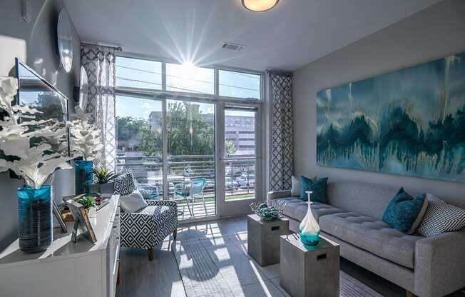Living Room With Expansive Window at Link Apartments® Glenwood South, North Carolina, 27603
