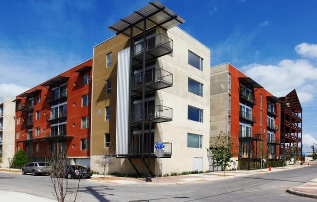 a new apartment building on the corner of a street