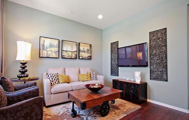 a living room with a couch and a table at The Vines at Riverpark, LLC, Oxnard, 93036