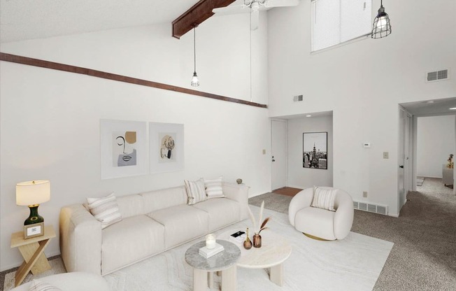 a living room with white walls and a white couch