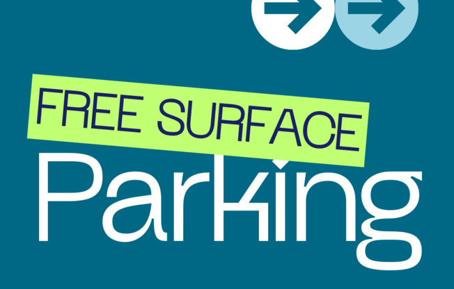 A sign advertising free surface parking at Creekpointe Apartments.